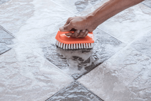 deep cleaning the grouts in between the floor tiles